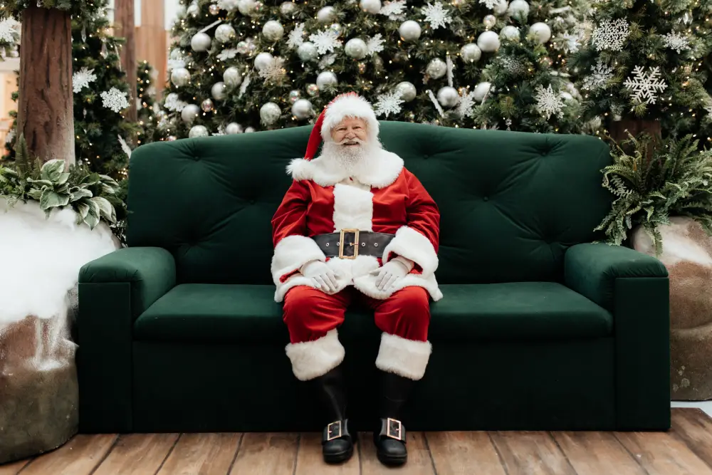 Santa on green sofa at Guildford Town Centre